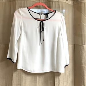 White blouse with black detailing